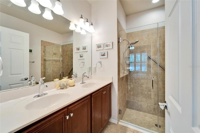 bathroom with vanity and a shower with door