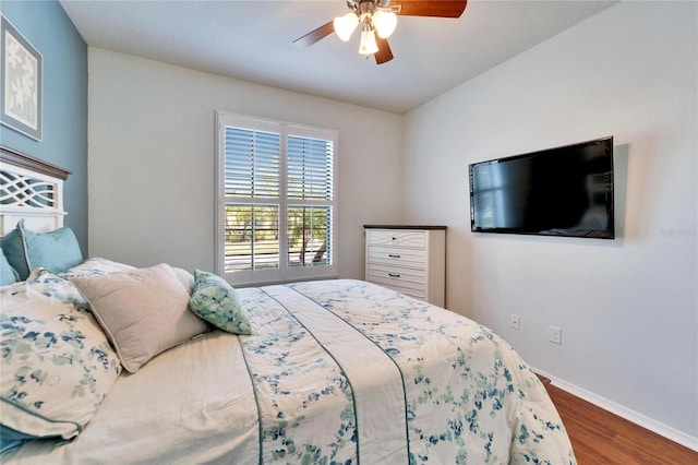 bedroom with wood-type flooring and ceiling fan