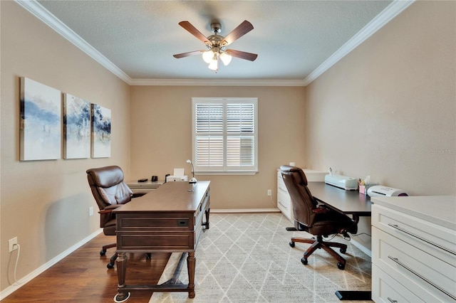 home office with ceiling fan, ornamental molding, and light hardwood / wood-style flooring