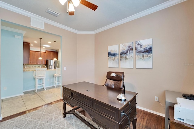 office area with crown molding, light tile patterned floors, and ceiling fan