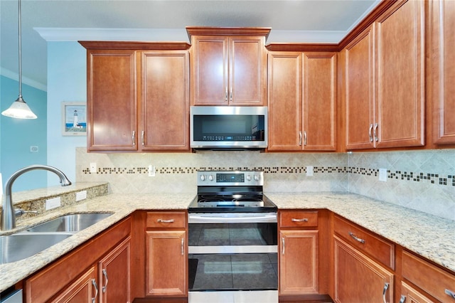 kitchen with tasteful backsplash, sink, hanging light fixtures, and appliances with stainless steel finishes