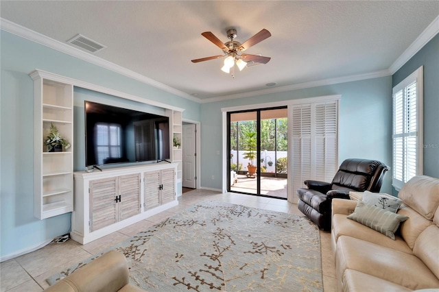 living room with crown molding, ceiling fan, and light tile patterned flooring