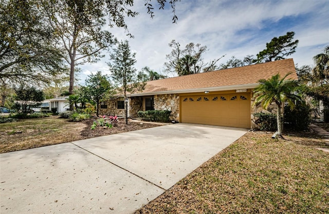 single story home with a garage and a front yard