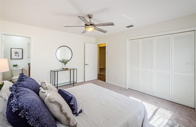 carpeted bedroom featuring ceiling fan and a closet