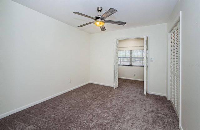 unfurnished bedroom featuring carpet, ceiling fan, and a closet