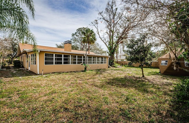 view of yard featuring a sunroom