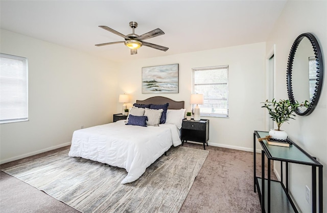 bedroom with light colored carpet and ceiling fan