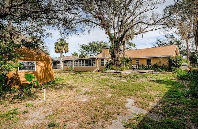 view of yard with a sunroom