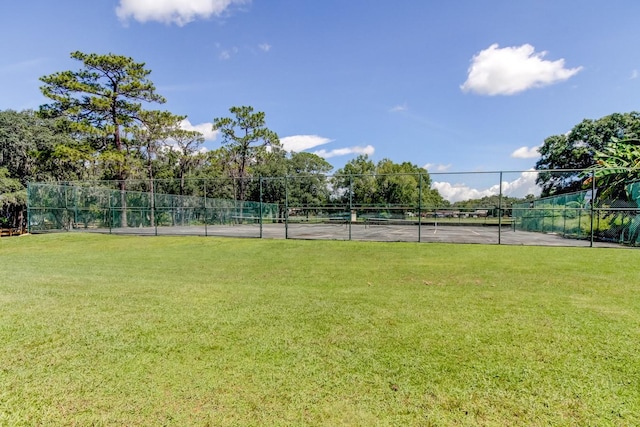 view of yard featuring tennis court