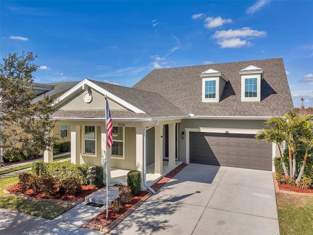 view of front of home featuring a garage and a porch