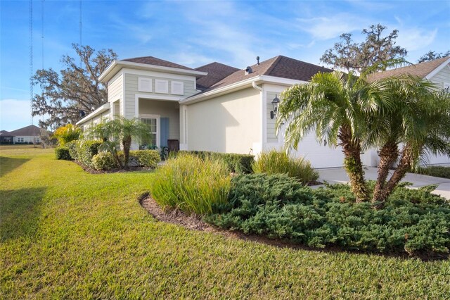 view of home's exterior with a lawn