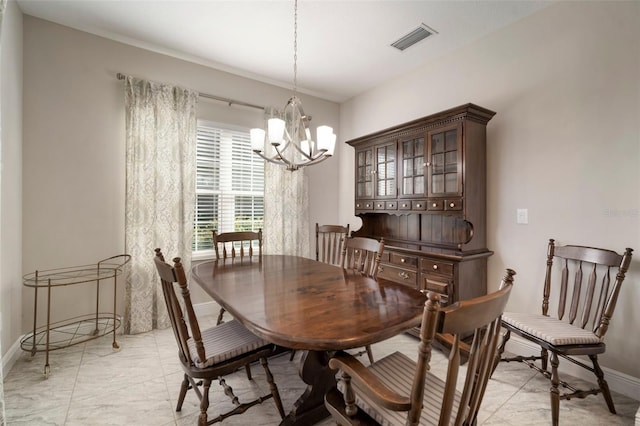 dining room featuring a notable chandelier