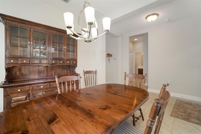 dining area featuring a chandelier