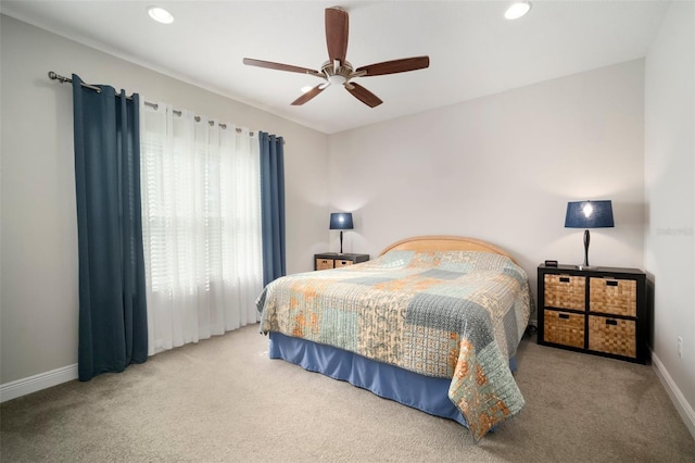 carpeted bedroom with ceiling fan