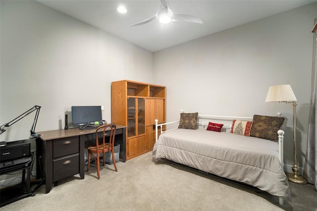 bedroom featuring ceiling fan and light carpet