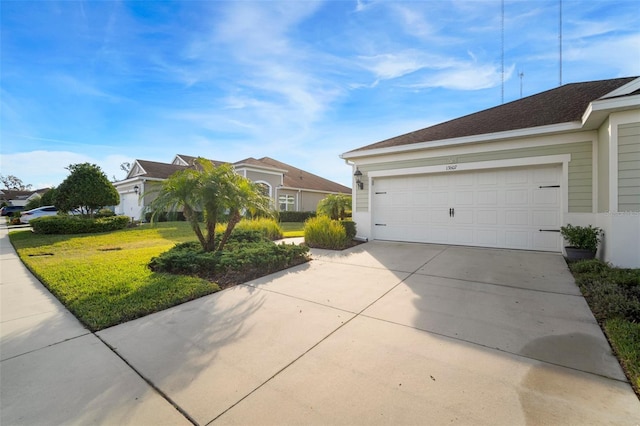 view of home's exterior featuring a garage and a lawn