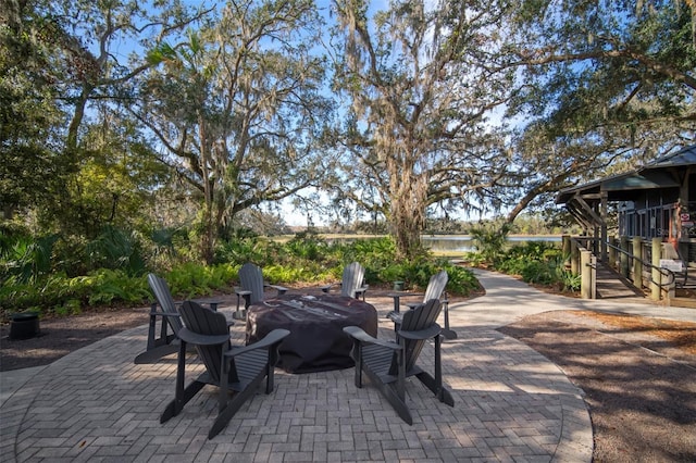 view of patio / terrace with an outdoor fire pit