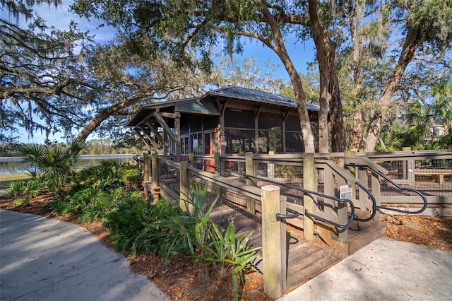 view of front of property featuring a sunroom