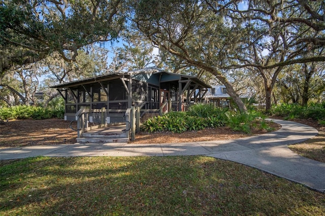 view of front of home with a sunroom