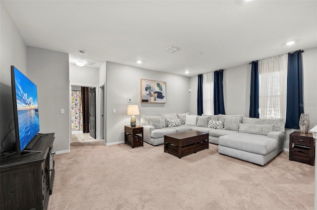 living room with light carpet, recessed lighting, visible vents, and baseboards