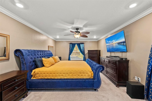 bedroom with ornamental molding, light colored carpet, and ceiling fan