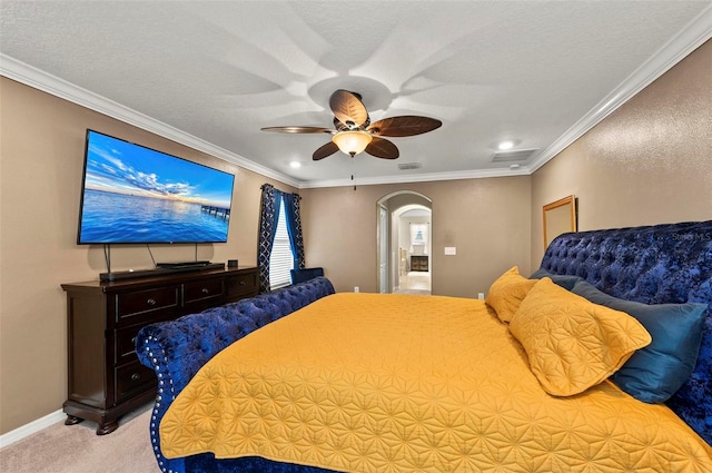 bedroom featuring arched walkways, crown molding, visible vents, light carpet, and a textured ceiling