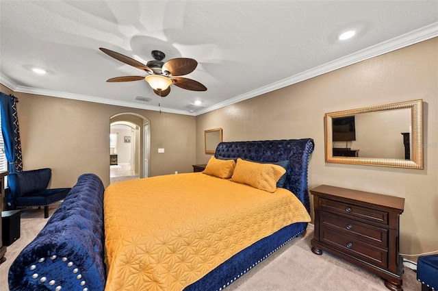 bedroom with light carpet, ornamental molding, and arched walkways