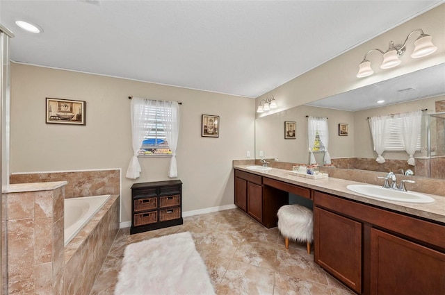 full bathroom featuring double vanity, a sink, a bath, and baseboards