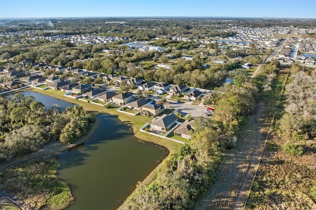 bird's eye view featuring a residential view and a water view