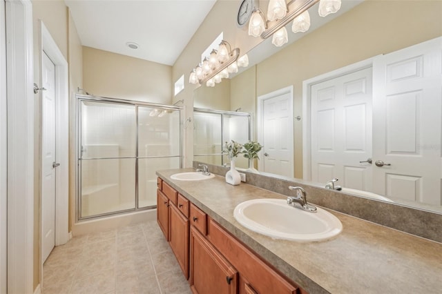 bathroom featuring vanity, tile patterned floors, and walk in shower