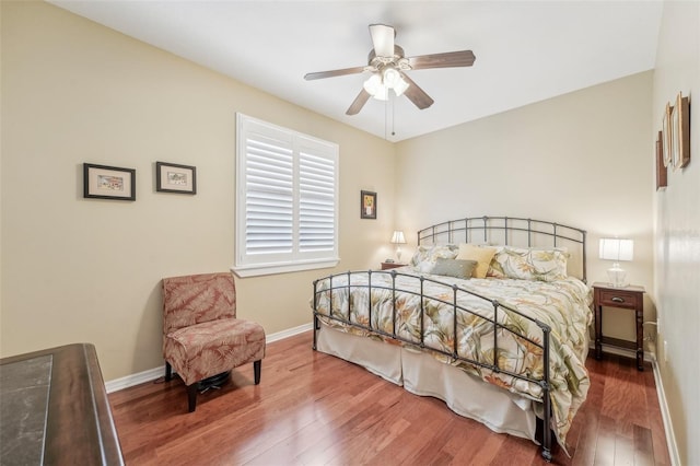 bedroom with wood-type flooring and ceiling fan