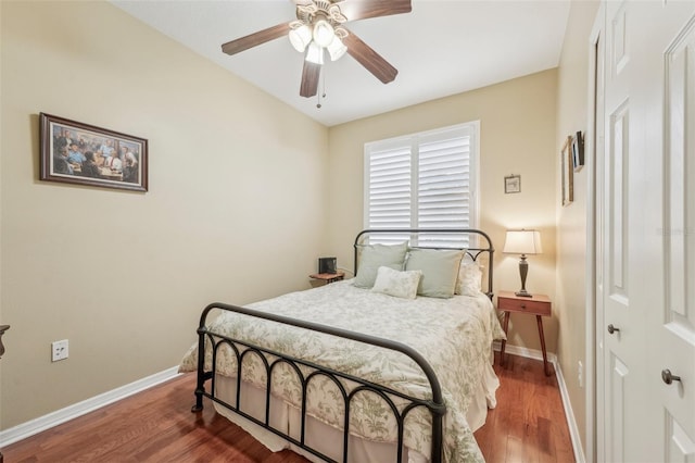 bedroom with wood-type flooring and ceiling fan