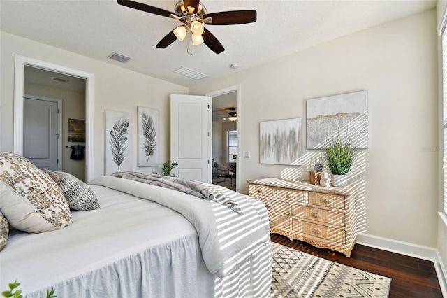 bedroom featuring dark hardwood / wood-style flooring and ceiling fan