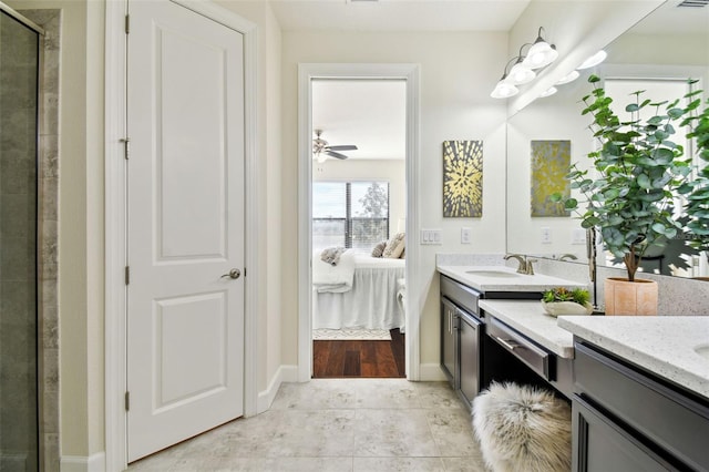 bathroom featuring walk in shower, ceiling fan, and vanity