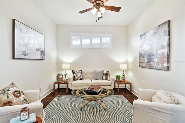 living room with ceiling fan and dark wood-type flooring