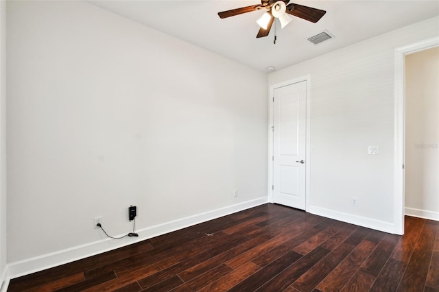 unfurnished room featuring ceiling fan and dark hardwood / wood-style flooring