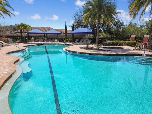 view of swimming pool featuring a patio area