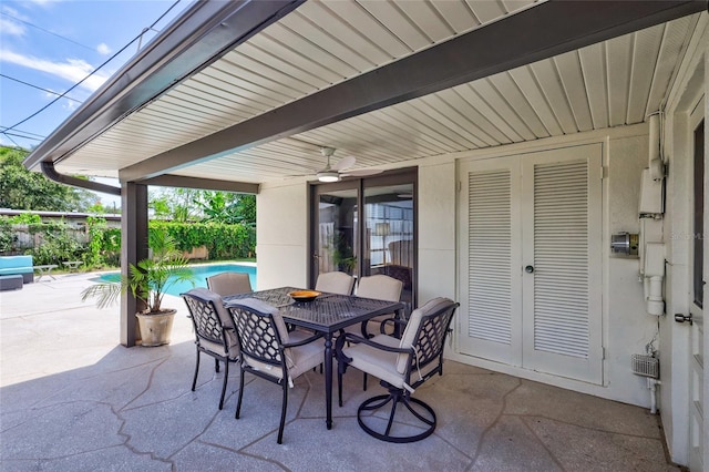 view of patio featuring french doors and ceiling fan