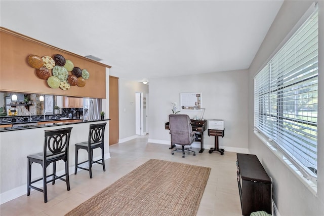 office area with light tile patterned flooring