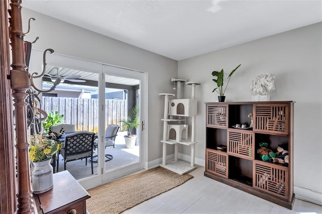 interior space with ceiling fan