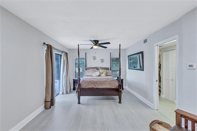 bedroom with light wood-type flooring and ceiling fan