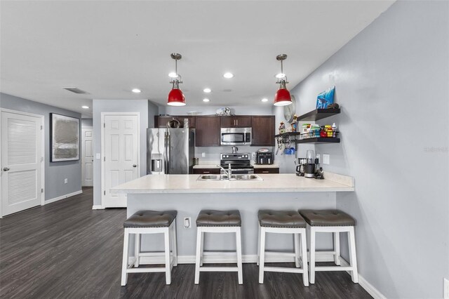 1203 Desmond St, Port Charlotte, FL 33952 - kitchen with light countertops, visible vents, appliances with stainless steel finishes, a sink, and a peninsula