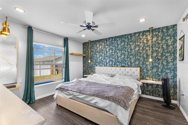 1203 Desmond St, Port Charlotte, FL 33952 - bedroom featuring baseboards, an accent wall, wood finished floors, and wallpapered walls