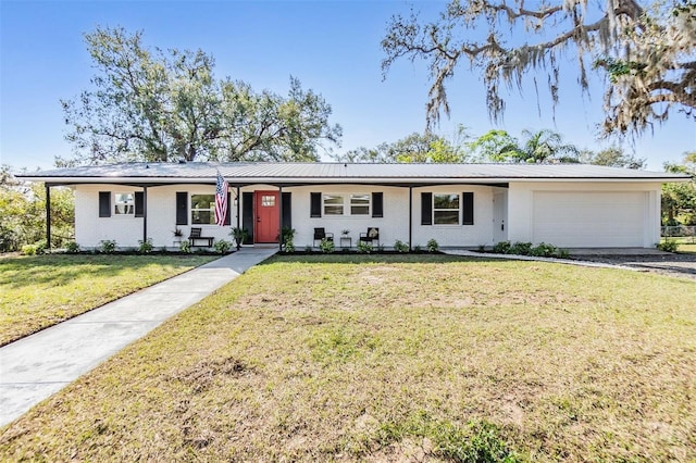 ranch-style house with a garage and a front lawn