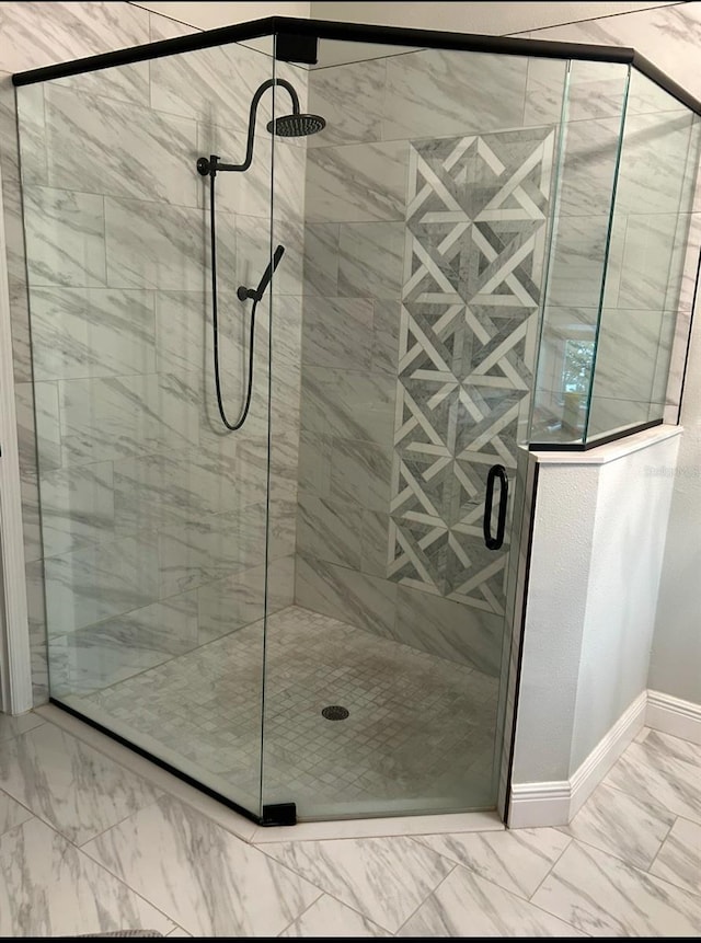 bathroom with a shower with shower door