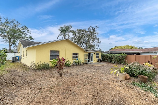 back of house featuring central AC unit and a patio area