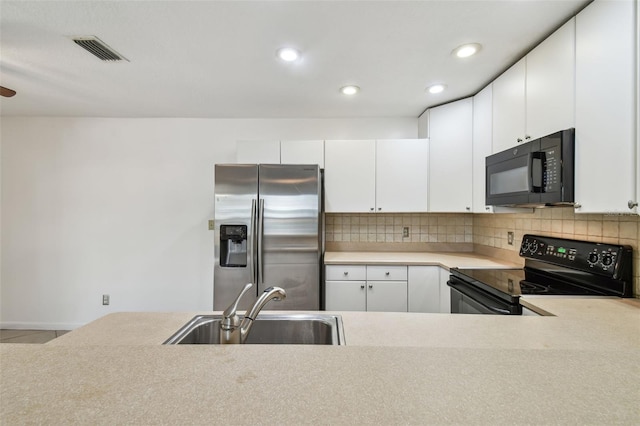 kitchen featuring white cabinetry, sink, backsplash, and black appliances