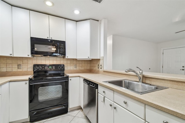 kitchen with decorative backsplash, sink, white cabinets, and black appliances