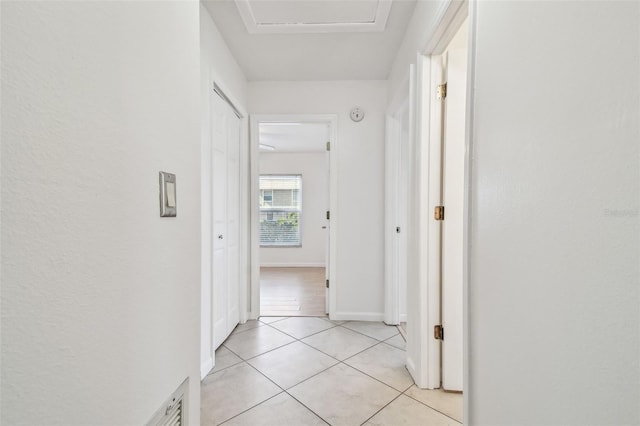 hall with light tile patterned flooring