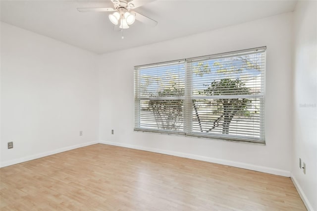 unfurnished room featuring ceiling fan and light wood-type flooring